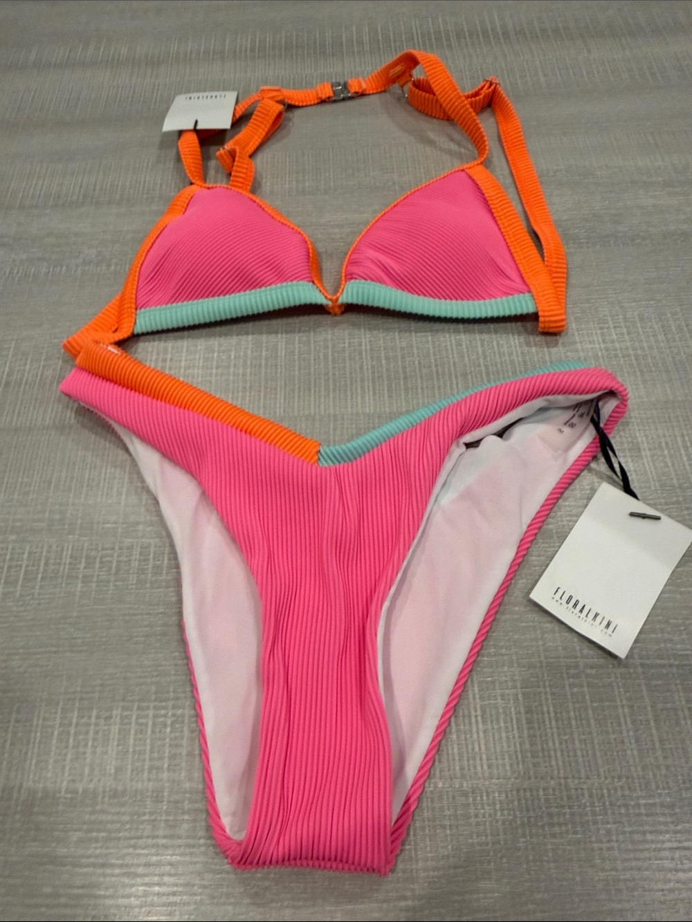 NWT Florakini bikini. Brand new. Bright pink, orange light green. Size S